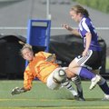 Bentonville goalkeeper Abby Risner comes out to challenge Fayetteville’s Casey O’Brien on April 15 a...