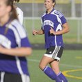Fayetteville’s Sarah Correll, right, talks with her teammates on April 15 during a match at Bentonvi...