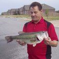 Bill Rankin of Centerton shows a 6.79-pound largemouth bass he caught and released at Lake Bentonvil...