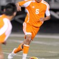 Rogers Heritage’s Phillip Amaya moves the ball downfield against Rogers High on April 16 at Heritage...