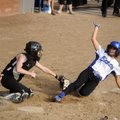 Springdale High catcher Erica Graham, left, tags Rogers High senior Alex Cook out at the plate Wedne...