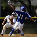  Bentonville’s Ryan Harralston, left, gloves the throw from catcher Blake Baxendale as Rogers High’s...