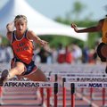  Rogers Heritage’s Brittany McClain, left, clears a hurdle ahead of Little Rock Central’s Te’Laura W...