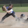  Rogers High’s Ashley Ferguson looks to tag out Bentonville’s Meg McGuirt at second base Thursday in...