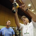 Tony Yager, right, of Sun Coast Energy Systems demonstrates Friday for Nathan Wilson of Decatur how...