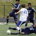 Springdale Har-Ber’s Jorge Gonzalez, on ground, and Mauricio Salas, left, attack the ball as Conway’...