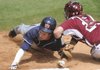 Arkansas catcher James McCann tags out Auburn’s Justin Fradejas on Saturday during the Tigers’ 8-7 victory at Baum Stadium in Fayetteville.