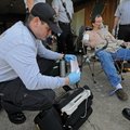 CARDIAC TRAINING - Brian Johnson, left, a Springdale paramedic, collects information from a 12-lead ...