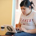 Norma Duran of Fayetteville uses a laptop Friday that she checked out from the Fayetteville Public L...