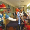 Calavarin the Clown gives Sabastion Sidon of Springdale a balloon character the clown created at the...