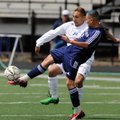 Springdale Har-Ber’s Uriel Sandoval, right, kicks the ball away from Rogers High’s Jose Sanchez in t...