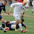 Rogers senior Spencer Dunlop pushes to the Springdale Har-Ber goal as Har-Ber senior Uriel Sandoval ...