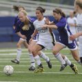 Bentonville’s Tayler Estrada pushes the ball past Mount St. Mary’s defenders during Saturday’s match...