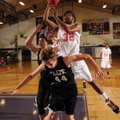 The Arkansas Wings’ Aaron Ross takes the ball to the basket over Northwest Arkansas Elite’s Nathan E...