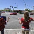 Hannah Duell and Hannah Ketter hold political signs and wave at motorists Monday in Fayetteville on ...