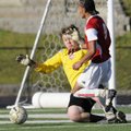 Springdale High’s Santos Martinez takes a shot at the goal while Russellville keeper Kiril Paletskih...