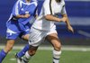 Bentonville’s Nicole Rouse drives the ball past Rogers High’s Ibett Cordona in Mountie Stadium in Rogers on Monday in the Class 7A State Tournament.