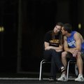Rogers High School student Casey Caton, 19, right, shares a moment with Sarah Conley, 18, as they wa...