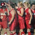 The Farmington team meets Teighlor Williams at the plate after she scored in the third inning agains...