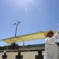 Arturo Manzano of Seaside Pools applies grout Tuesday to new tile circling the adult pool at the Kin...