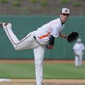 Rogers Heritage’s Hunter Wood pitches against Rogers High on Monday in Arvest Ballpark in Springdale...