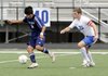 Springdale Har-Ber’s Mauricio Salas defends the ball against Conway’s John Allison, right, in the first half Friday in Gates Stadium in Rogers. The Wildcats won the Class 7A State Tournament match 3-0.