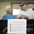 Sherry Glascock, left, has a voting machine set up Wednesday, May 5, by election official Stephen Be...