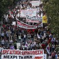 Pro communist protesters march during an anti government rally in Athens on Thursday. Greek lawmaker...