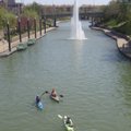 Paddlers enjoy an urban kayaking adventure in the Country Club Plaza district of Kansas City, Mo. Sa...