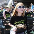 Annabelle Riley, 10, watches the Northwest Arkansas Naturals’ baseball game on Wednesday with her fo...