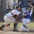  Rogers Heritage’s Spanky Purdy attempts to tag out Rogers High’s Alex Shelor on Thursday at Veteran...