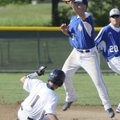  Rogers Heritage’s Spanky Purdy attempts to tag out Rogers High’s Alex Shelor on Thursday at Veteran...