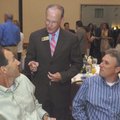  Bentonville Mayor Bob McCaslin, center, chats with Sam Pearson, left, of Bentonville and John Spenc...