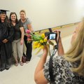  Sherine Raines, second from left, has her picture taken Thursday by her mother, Sandi Pirtle, aunts...