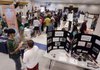People fill the aisles at a job fair Wednesday in Montpelier, Vt. First-time claims for unemployment benefits dropped last week, the Labor Department reported.
