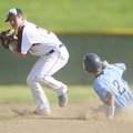  Springdale High’s Bryce Neal turns to throw to first base after forcing Springdale Har-Ber’s Josh B...