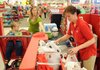 Target cashier Jeana Logue checks out Carol Anne Braswell and her son Tyler, 3, both of Lowell, Thursday morning in Rogers.