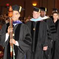 Alex Vasquez, Board of Trustees vice chairman, leads the processional Friday for the largest NorthWe...