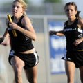 Bentonville’s Lauren Tininenko, left, sprints away for the second leg of the girl’s 4x100-meter rel...