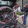TWO-WHEELER TINKER - Jose Alcala of Chicago builds a bicycle Friday in downtown Fayetteville. Alcala...