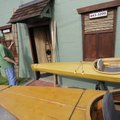 OLD TRADITION FLOATS - Skip Beaton of Fayetteville sets a model of a skin-boat Friday outside of his...