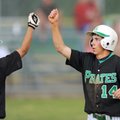  Greenland’s Dustin Oakes, right, is congratulated by Salvador Rojas after scoring on a wild pitch d...