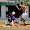  Elkins’ Blake Bailey 
slides into home plate as Lamar’s Zach Ward moves in to make the tag during ...