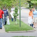  Volunteers from Crossculture Church pick up litter Saturday on West Central Avenue in Bentonville. ...