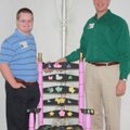  Chair Affair artist Thomas Van Bebber, left, shows Life Styles board member Blair Johanson his chai...
