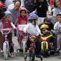 Zachary Kessler, 5, center, of Fayetteville  sits in front of the starting pack as they receive last...