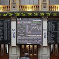 A trader watches a screen at the Stock Exchange in Madrid on Monday. Spain's Finance Ministry said S...