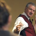 Russell Turner performs a card trick April 24 as part of an object lesson while teaching Turning Poi...