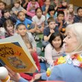 Arkansas first lady Ginger Beebe points out illustrations as she reads “Winston the Book Wolf” to se...
