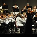 Ashley Whittle, 14, of Springdale performs a violin solo with the Arkansas Philharmonic Orchestra on...